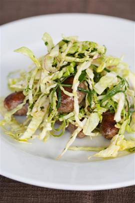 Pork and fennel sausages with cabbage and red wine vinegar. Photo: Riverstone Kitchen