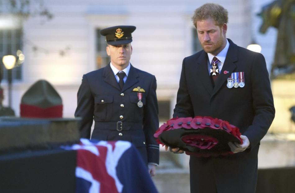 Prince Harry lays a wreath at an Anzac Day service in London. Photo: Reuters