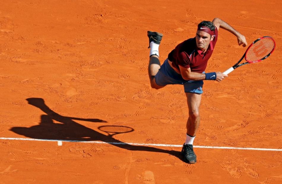 Roger Federer serves during his win. Photo: Reuters