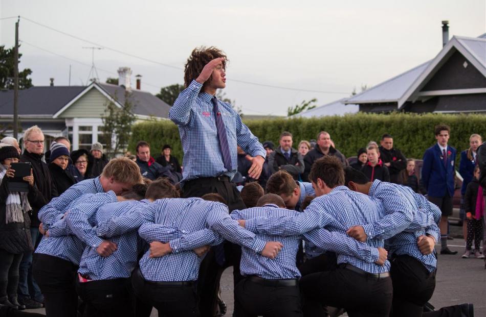 South Otago High School pupil Josh Hill leads his first XV rugby teammates in a haka at the Anzac...