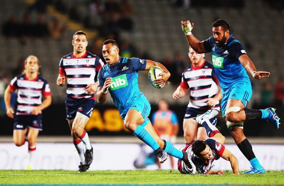 Tevita Li makes a break for the Blues against the Rebels. Photo: Getty Images