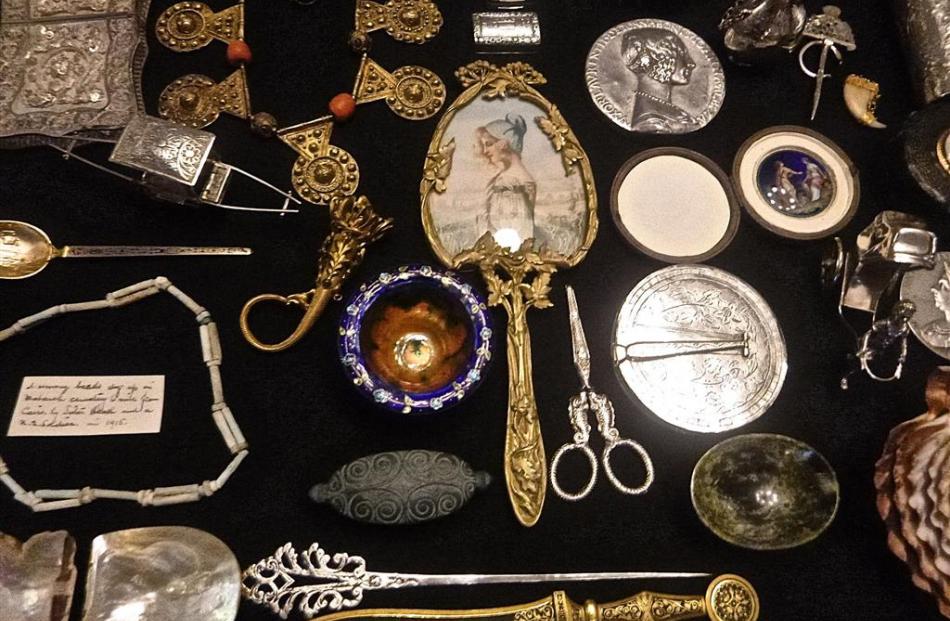 The accumulated curios in the Theomins' cabinet reflect family interests and reveal historic,...