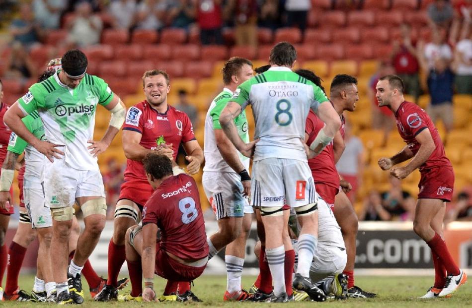 The Highlanders and Reds react at the end of their game at Suncorp Stadium. Photo: Getty Images