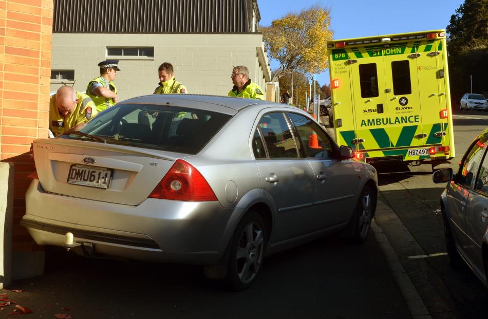 A 20-year-old woman was trapped for a short time between a car and a wall. Photo by Stephen...