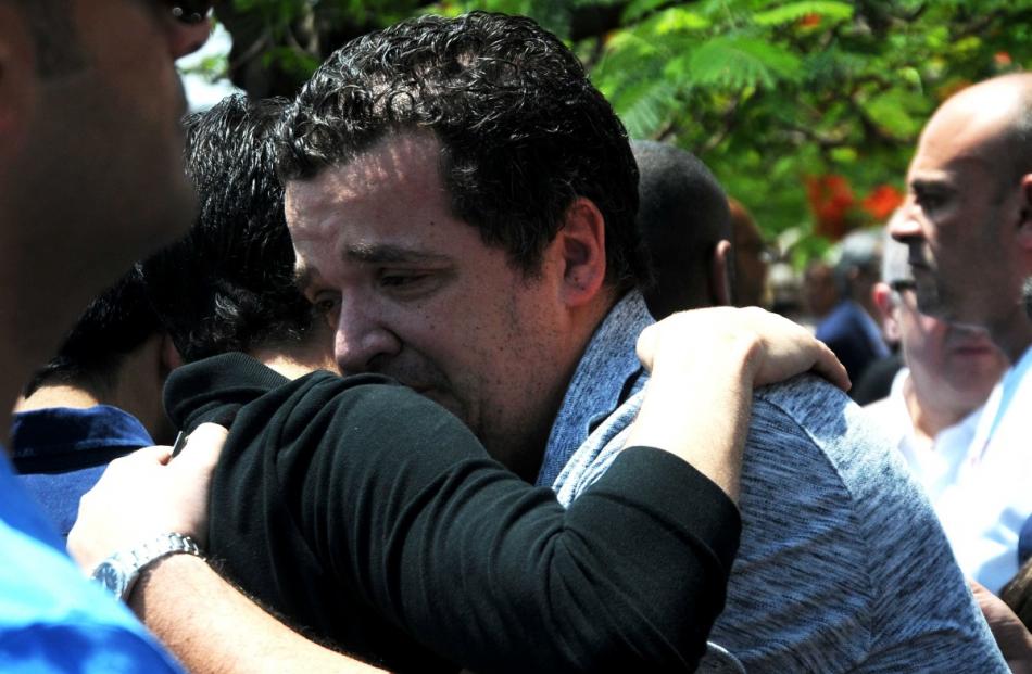 A relative of the victims of the missing EgyptAir flight MS804 reacts after a sympolic funeral in...