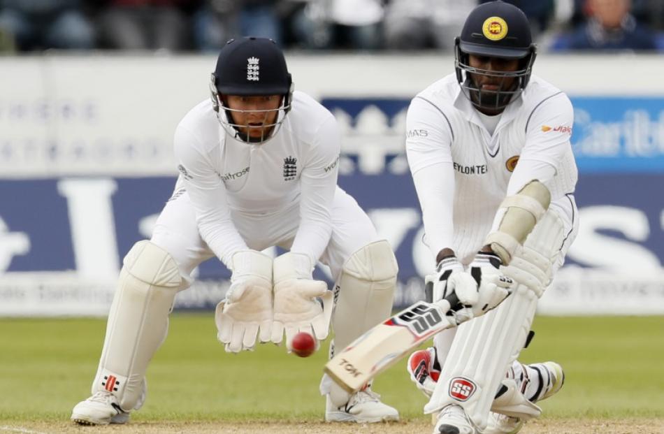 Angelo Mathews plays a reverse sweep against England. Photo: Reuters
