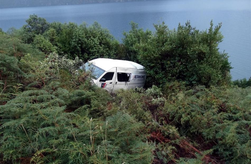 At 4.10pm yesterday, a Toyota van crashed off SH6 at the Devil's Staircase. Photos by Paul Taylor.