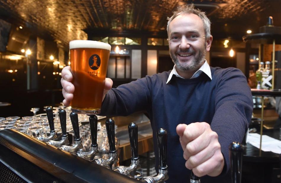 Operations manager Sheldon Lye, with a freshly poured beer at Dunedin's Captain Cook Hotel....