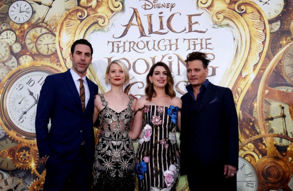 Cast members (L-R) Sacha Baron Cohen, Mia Wasikowska, Anne Hathaway and Johnny Depp pose at the...