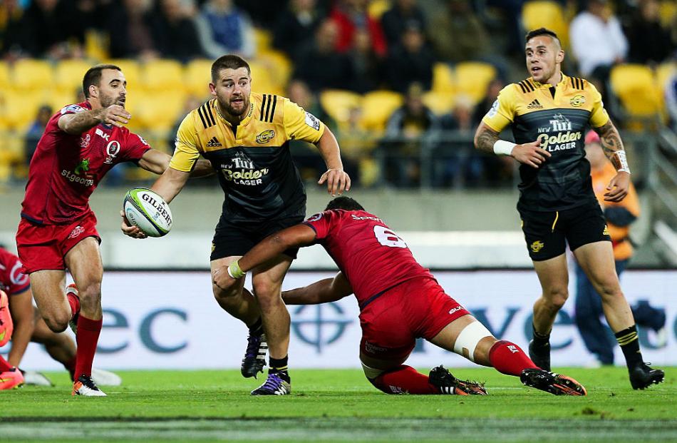 Dane Coles looks to offload for the Hurricanes against the Reds. Photo: Getty Images