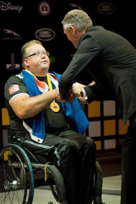 Glenn Barnes is awarded the first gold medal for the New Zealand Defence Force at the Invictus...