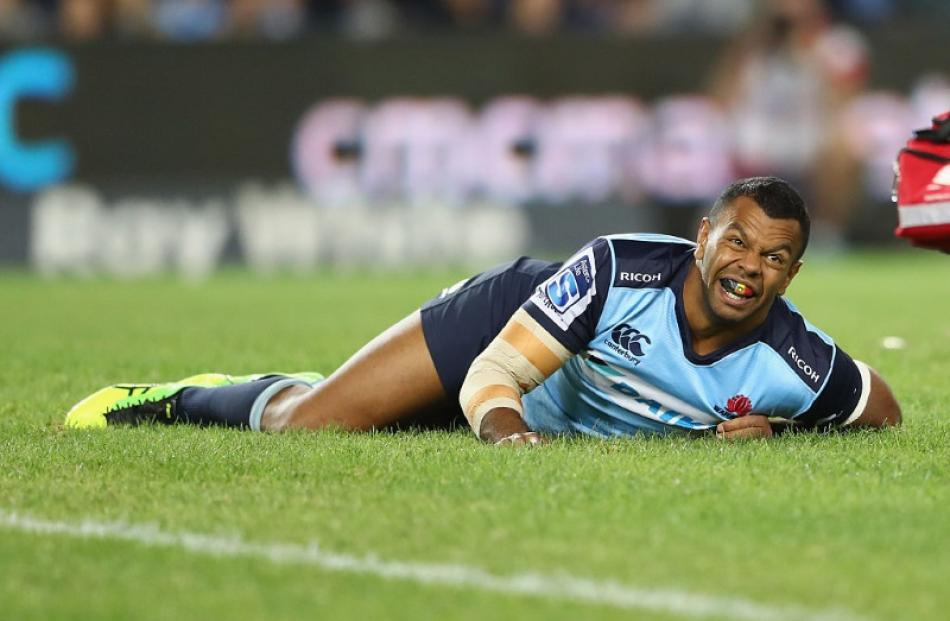 Kurtley Beale looks to the sideline after injuring his leg. Photo: Getty Images