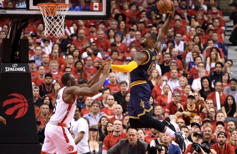 LeBron James goes up for a slam dunk as the Cleveland Cavaliers clinched a spot in the NBA Finals...