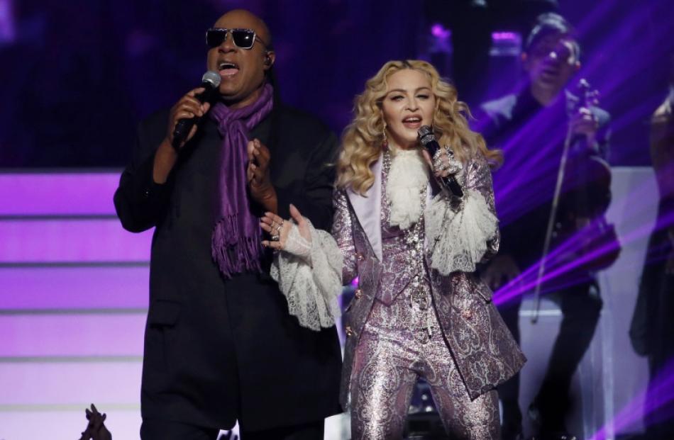 Madonna performs "Nothing Compares 2 U" with Stevie Wonder in a tribute to Prince. Photo: Reuters