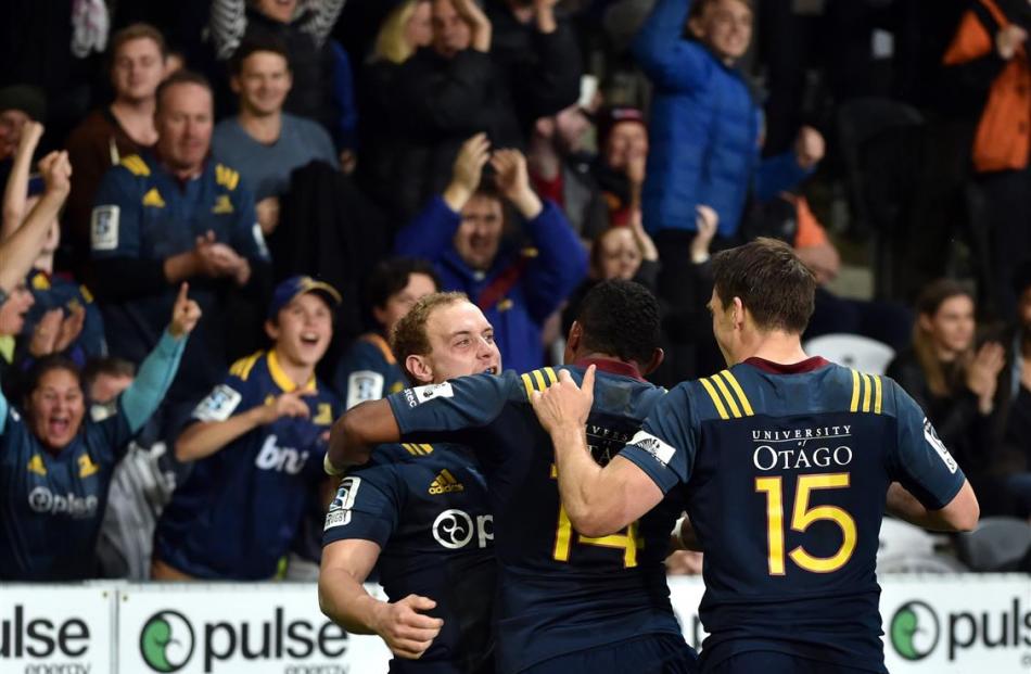 Man of the moment Highlander Matt Faddes is congratulated by team-mates Waisake Naholo and Ben...