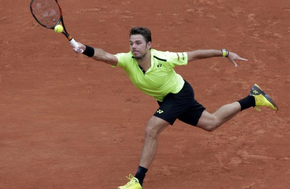 Stan Wawrinka reaches to play a shot during his win over Viktor Troicki. Photo: Reuters