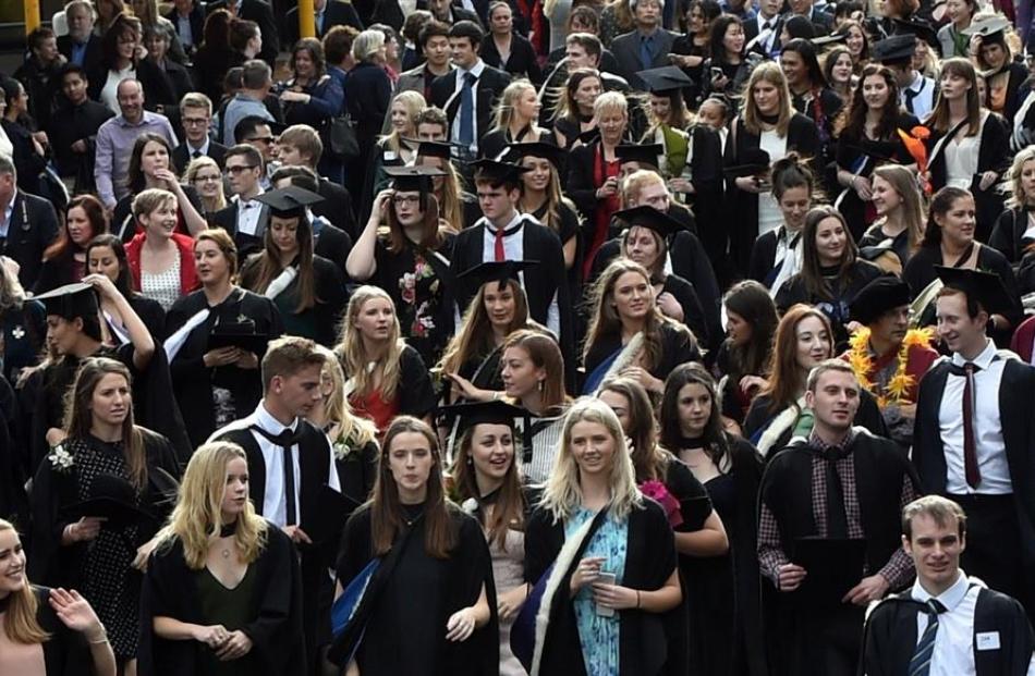 University of Otago graduands parade along George St  on Saturday before attending a 1pm...