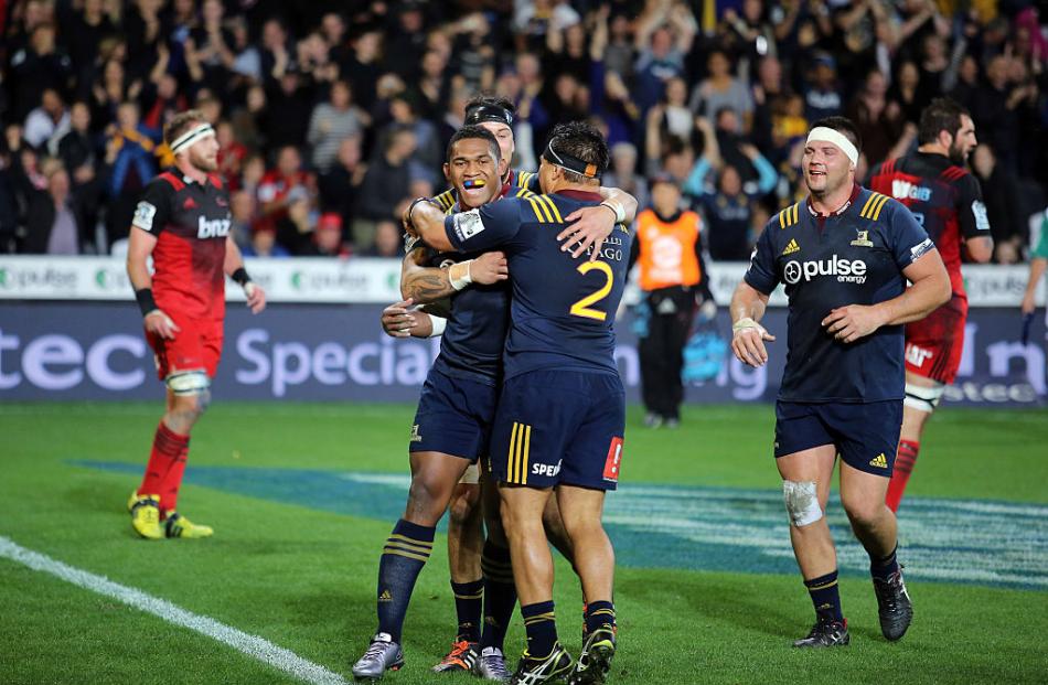 Waisake Naholo celebrates a try with Ash Dixon for the Highlanders. Photo: Getty Images