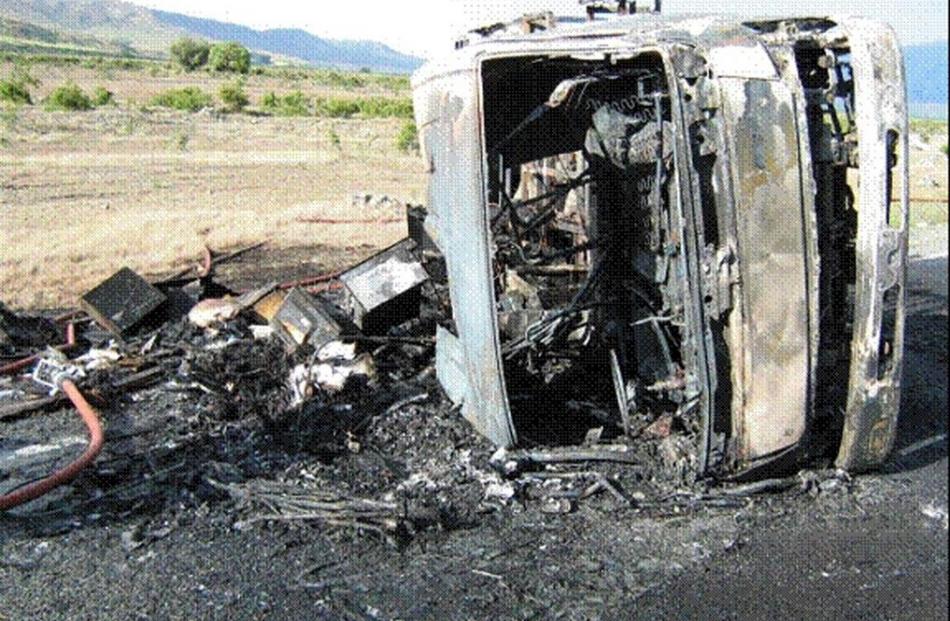 A camper van destroyed by fire after it overturned on the Omarama side of the  Lindis Pass...