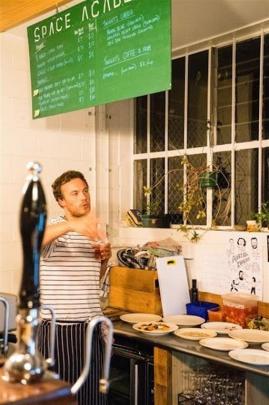 Alex Davies creates in the kitchen of Space Academy where he holds his ''Gatherings''. Photo:...
