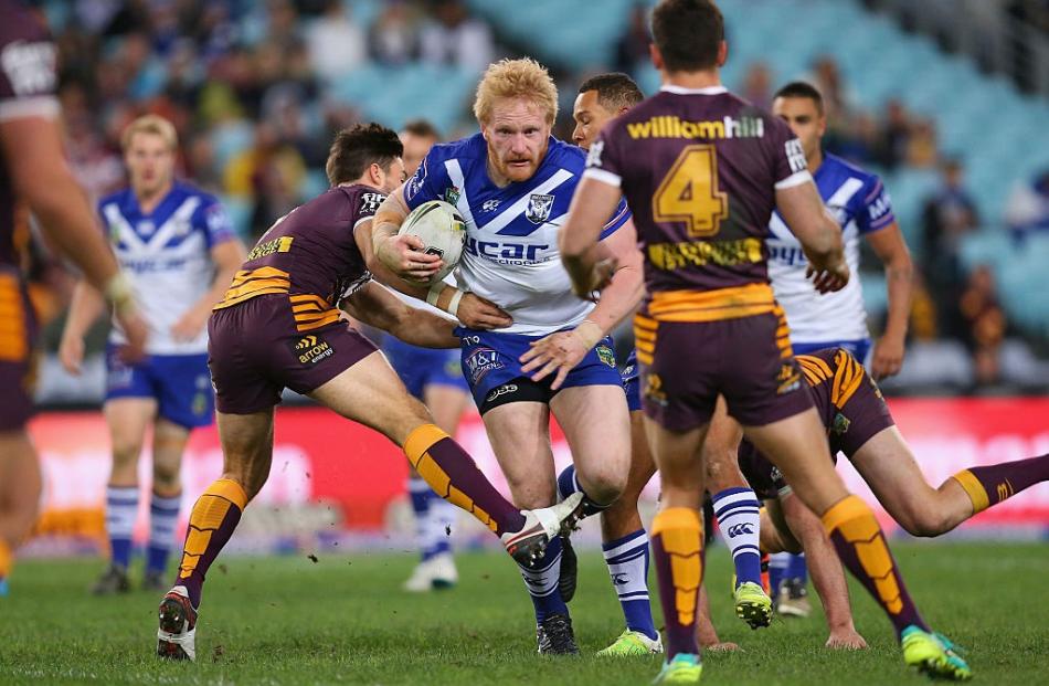 Bulldogs prop James Graham carries the ball against the Broncos. Photo: Getty Images