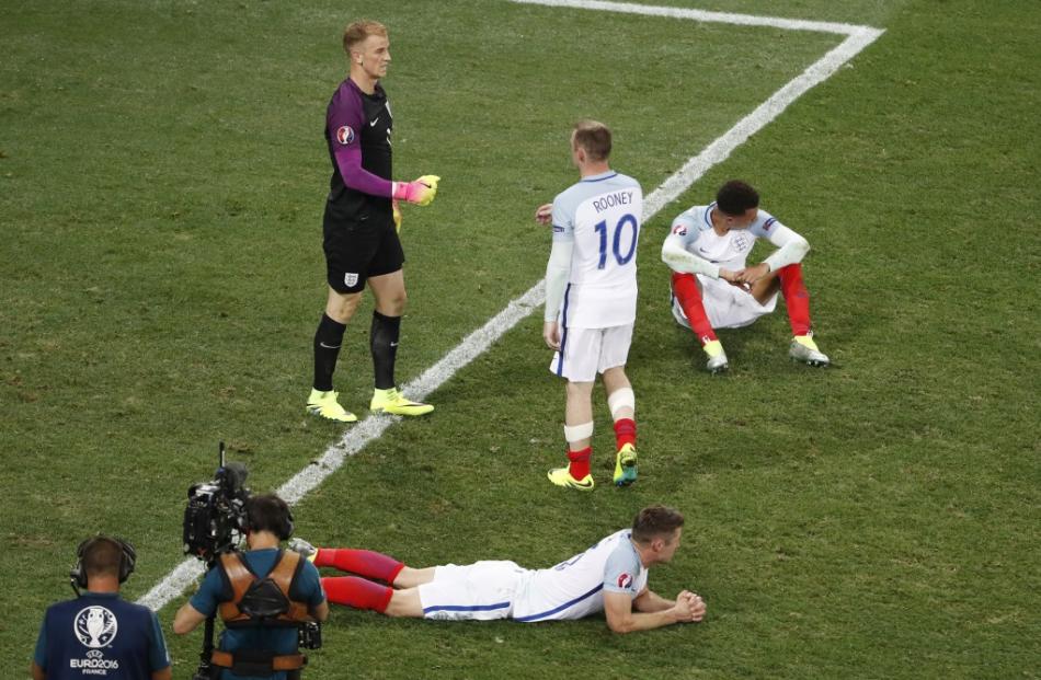 England's Wayne Rooney and Joe Hart look dejected at the end of the game. Photo: Reuters