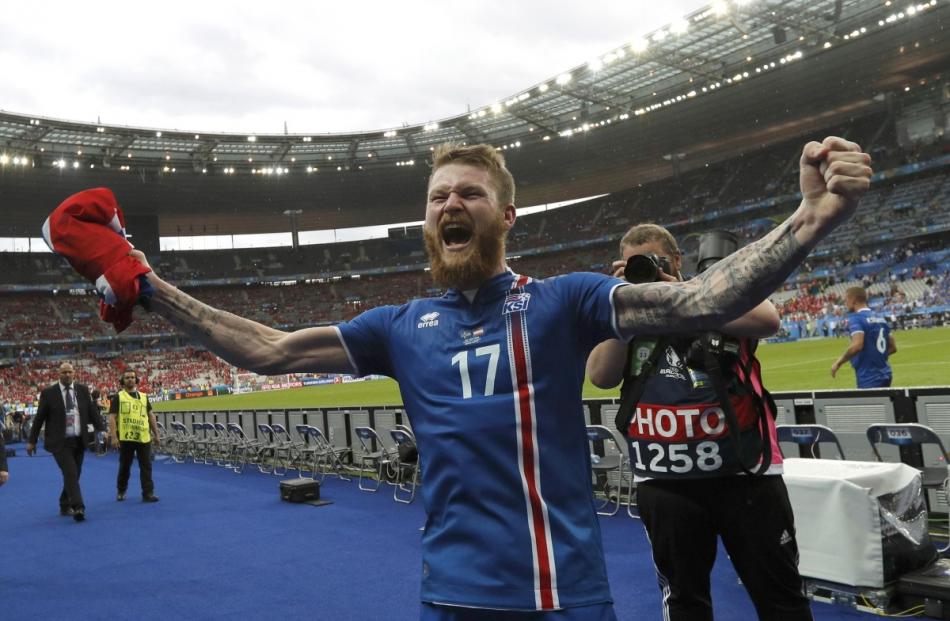 Iceland's Aron Gunnarsson celebrates after his teams victory over Austria. Photo by Reuters
