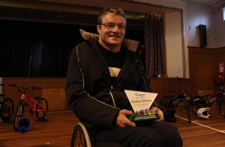 Kaitangata man Dallas Storer holds the Sport Maker Award he was presented with on Sunday to...