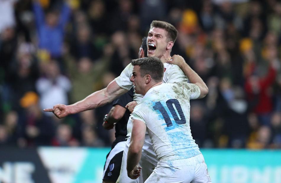 Owen Farrell and George Ford celebrate after Farrell's match winning try. Photo: Getty Images