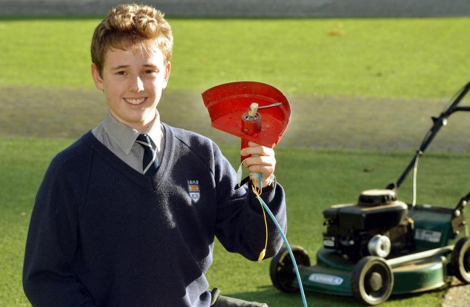 Sam Hewson with his clip-on lawn edger for lawnmowers. Photo by Stephen Jaquiery.