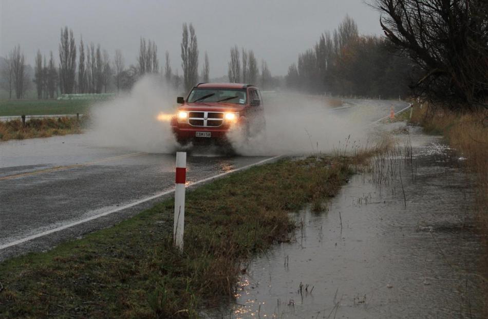 Surface flooding requires drivers on State Highway 83 near Papakaio School, about 17km north of...