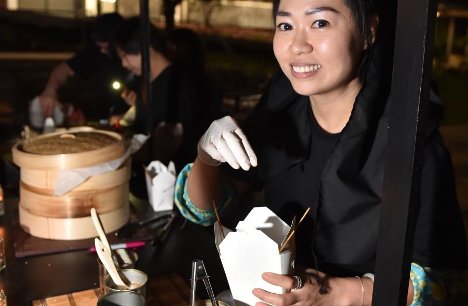 Wenting Zhang, of Dunedin, prepares Asian street food at Otago Polytechnic last night at Fire and...