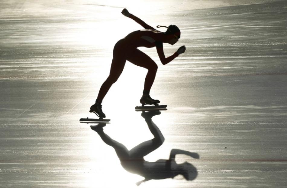 China's Shi Xiaoxuan skates in the women's 1500m speed skating event at the first winter Youth...