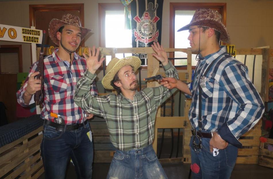 Henrique Waihrich (centre) is ``held up'' by brothers Victor (left) and Felipe Aguiar. Photos by...