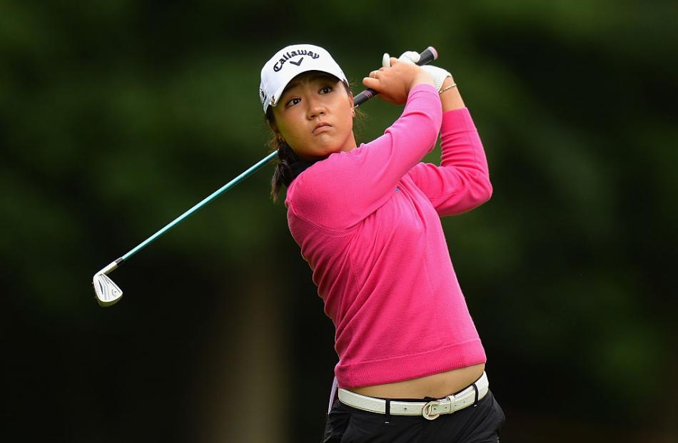 Lydia Ko hits her second shot on the third hole. Photo: Getty Images