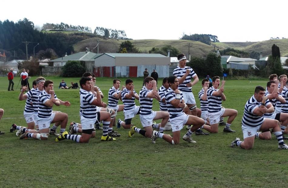 The Otago Boys' High School first XV performs a haka. Photo by Daniel Birchfield.