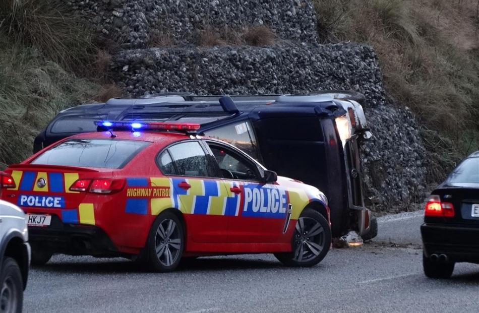 This vehicle overturned in Gorge Rd, Queenstown, yesterday morning. Photo by David Williams.