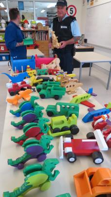Otago Corrections Facility carpentry instructor Mark O'Kane with toys prisoners made for children who were in Dunedin Hospital. Photo supplied.