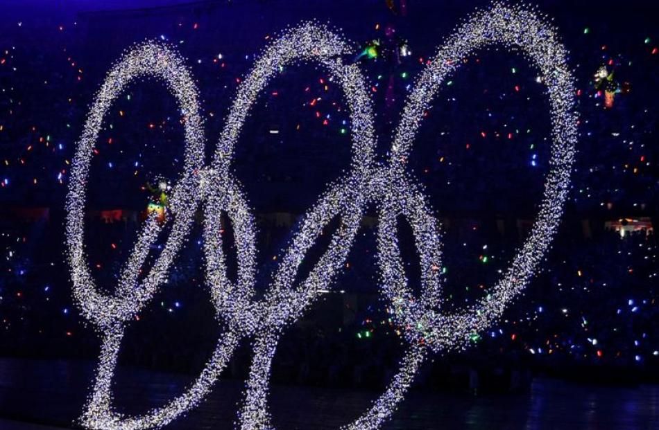 The Olympic rings are lifted during the opening ceremony. (AP Photo/Ricardo Mazalan)
