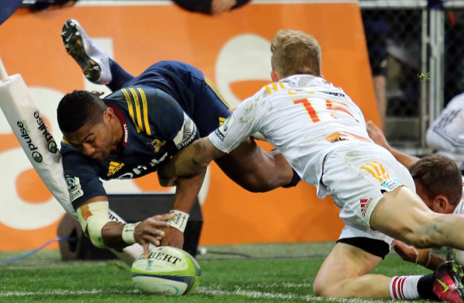 Highlanders winger Waisake Naholo shows impressive athleticism to score against the Chiefs. Photo...