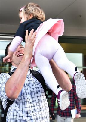 Ben Smith spends time with his daughter, Annabelle, before boarding the team bus. Photos by Peter...