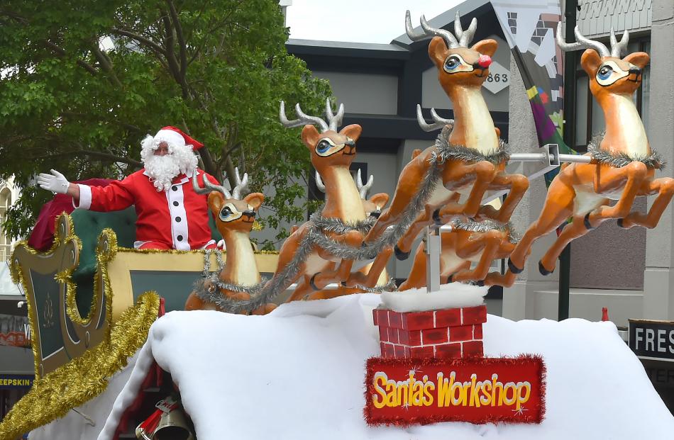 Santa and his reindeer make a triumphant appearance at the end of the Dunedin Christmas parade....