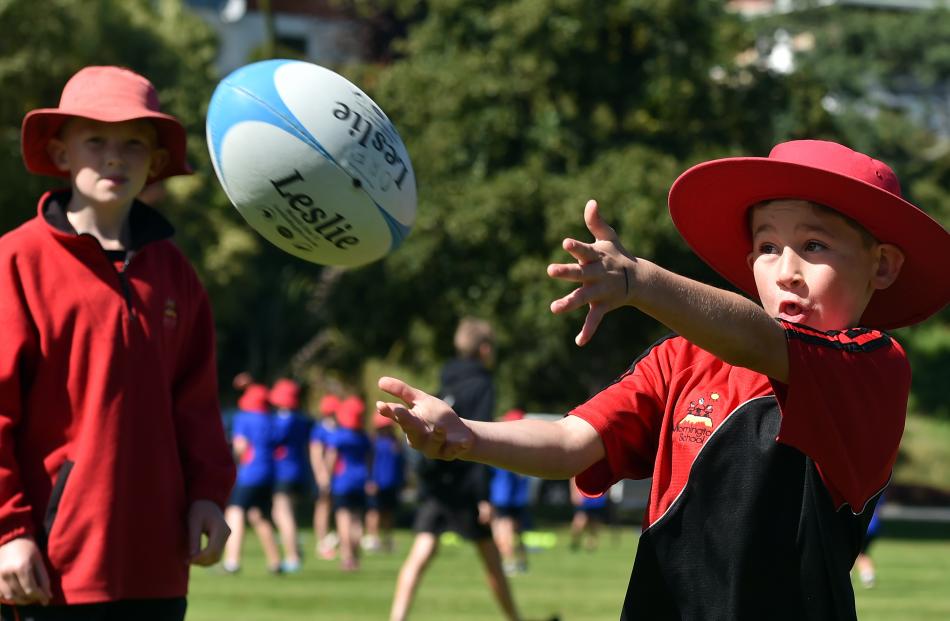 Mornington School pupil Coban Sullings (9) tries his hand at rugby.