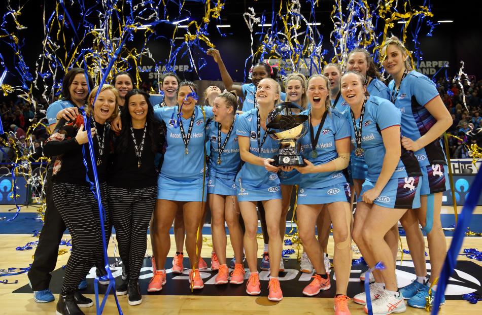 The Southern Steel players and staff celebrate with the ANZ Premiership trophy  after beating the...