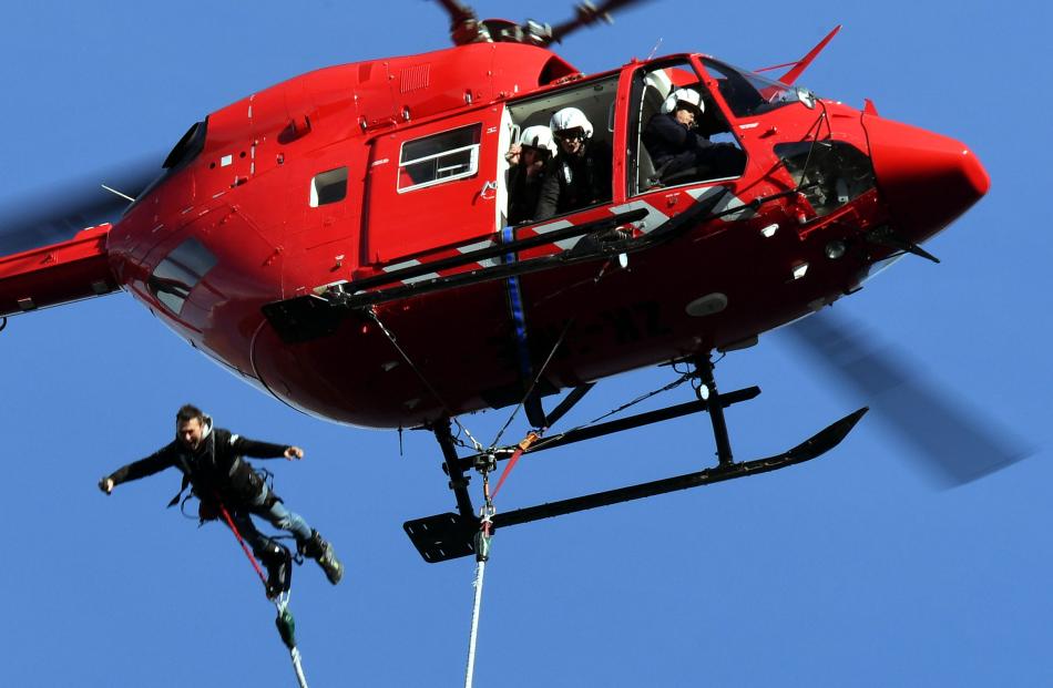 Using a cord he made himself, AJ Hackett Bungy employee Quinn Gardiner jumps from a Heli Otago...