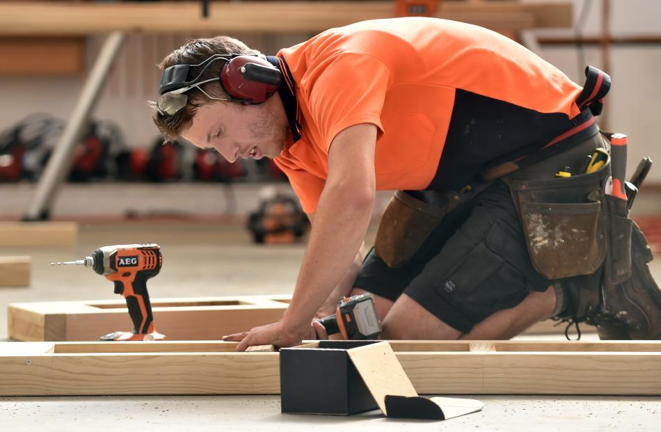 2017 New Zealand Certified Builders Apprentice Challenge Otago winner Chris McLean works on his version of an outdoor table.