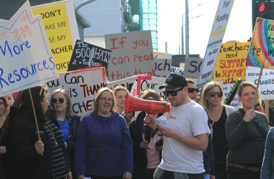 A crowd of about 200, including 133 teachers from 16 North Otago schools, march through Oamaru for smaller class sizes and a pay hike to address a teacher shortage. Photo: Hamish MacLean