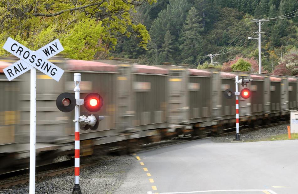 A Dunedin photographer, Jordy Cleaver, captures images of pedestrians walking in front of approaching trains, prompting a warning from KiwiRail for people to be alert to the dangers. PHOTOS: STEPHEN JAQUIERY AND JORDAN CLEAVER