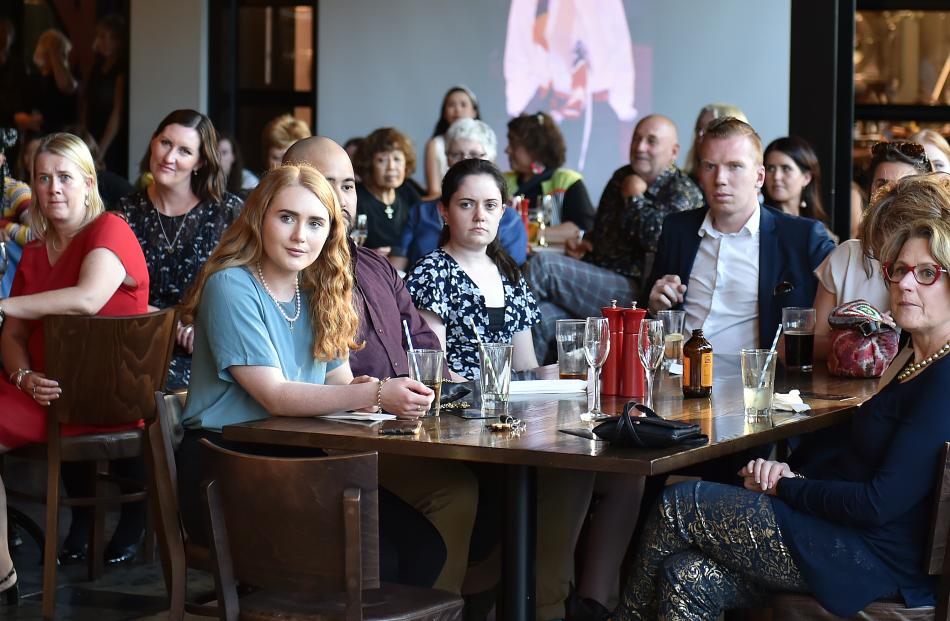 Punters at the launch listen to speeches.