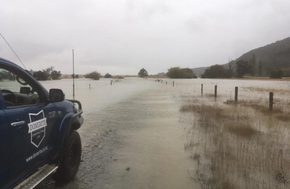 Part of the Glenorchy-Paradise Rd was closed due to surface flooding yesterday. PHOTO: DOWNER 
